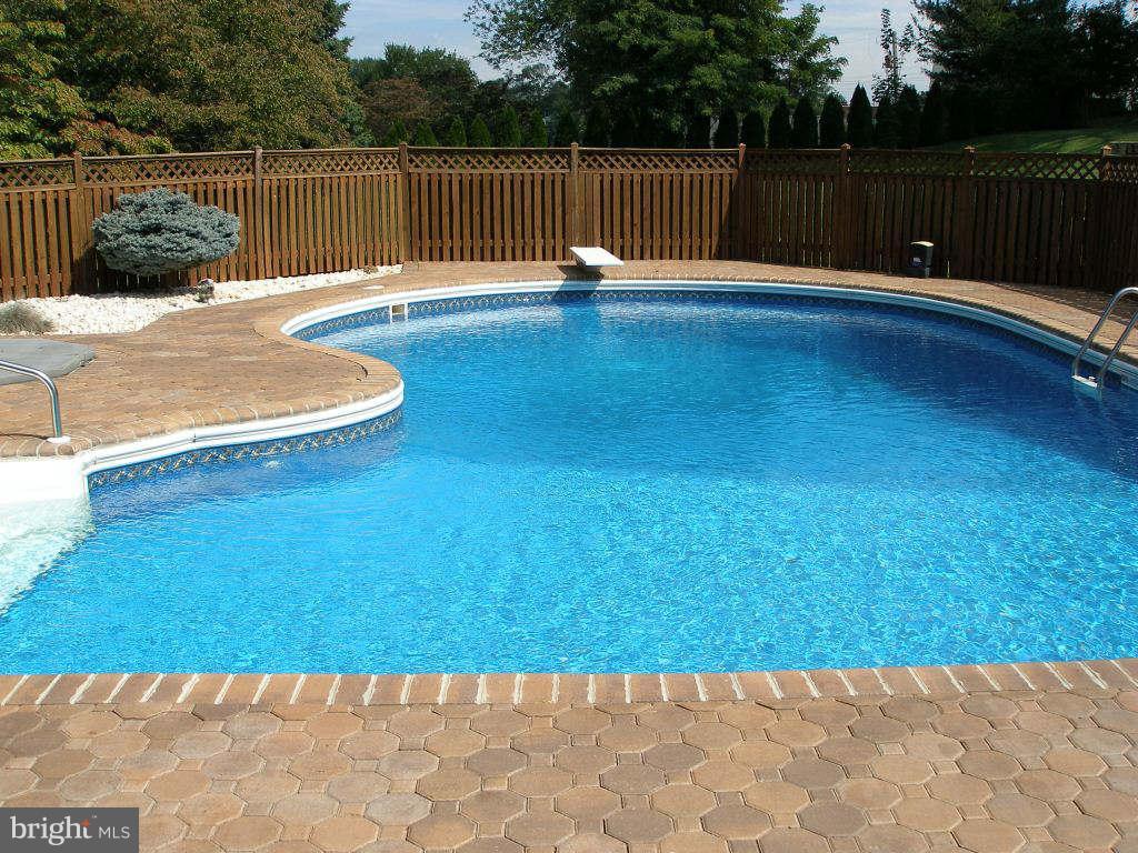 Lovely pool with massive pavor patio