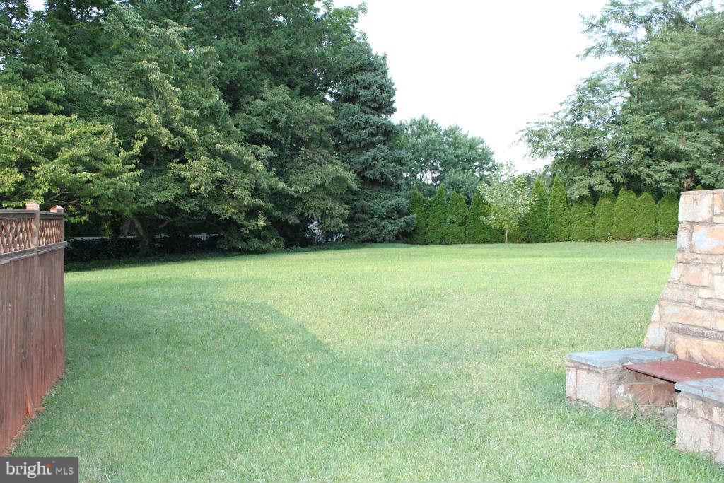 spacious lawn in rear of home