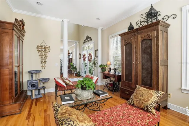 a view of a dining room with furniture and wooden floor