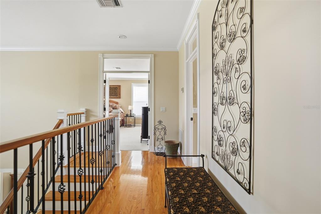 23337 Lake Lindsey Road Brooksville, FL 34601 - Photo 25 of 59 a view of a hallway with wooden floor and windows