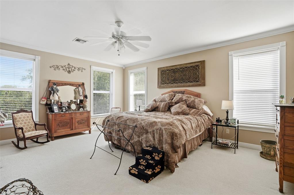 23337 Lake Lindsey Road Brooksville, FL 34601 - Photo 26 of 59 a bed room with a bed and a chair