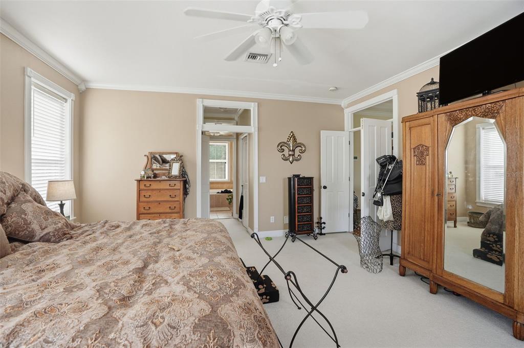 23337 Lake Lindsey Road Brooksville, FL 34601 - Photo 27 of 59 a bedroom with a large bed and a flat tv screen