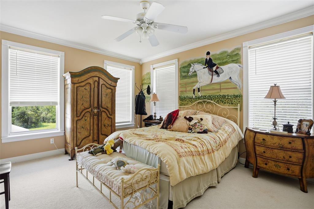 23337 Lake Lindsey Road Brooksville, FL 34601 - Photo 33 of 59 a bedroom with bed and wooden floor