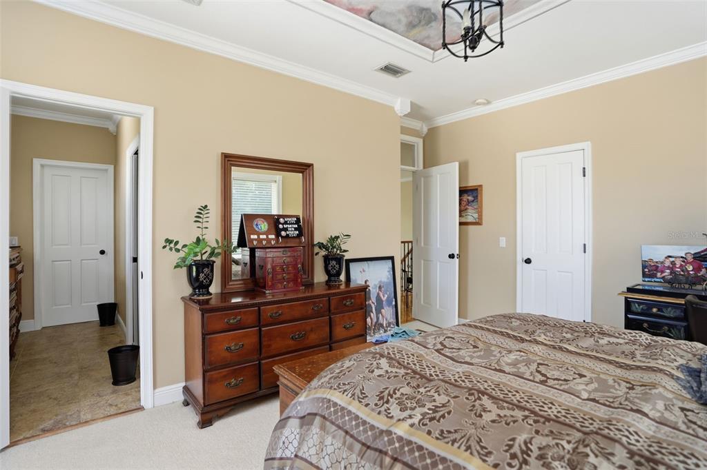 23337 Lake Lindsey Road Brooksville, FL 34601 - Photo 35 of 59 a bedroom with a bed and a dresser