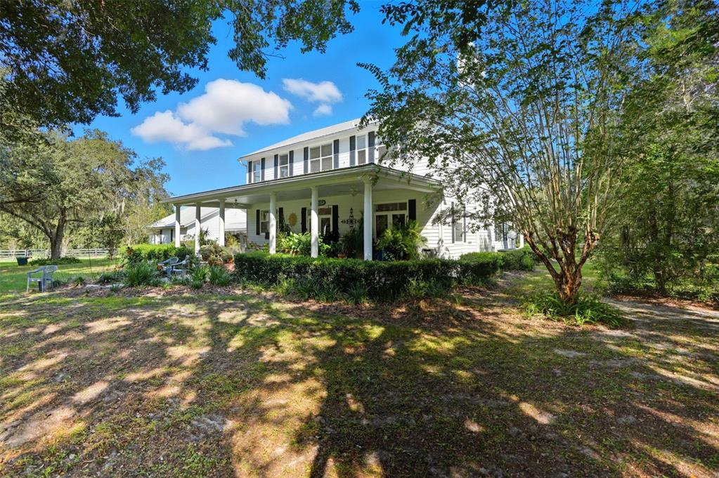 23337 Lake Lindsey Road Brooksville, FL 34601 - Photo 41 of 59 a front view of a house with a yard