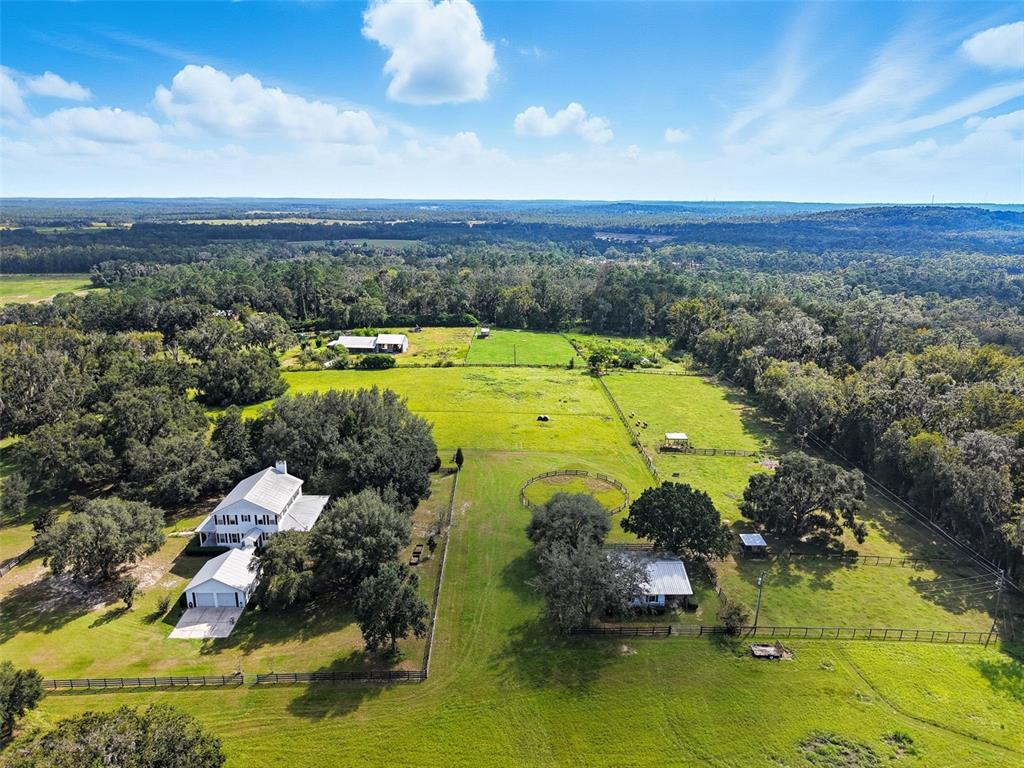23337 Lake Lindsey Road Brooksville, FL 34601 - Photo 53 of 59 an aerial view of residential houses with outdoor space