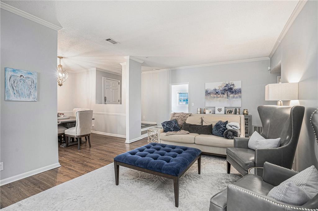 a living room with furniture and a rug