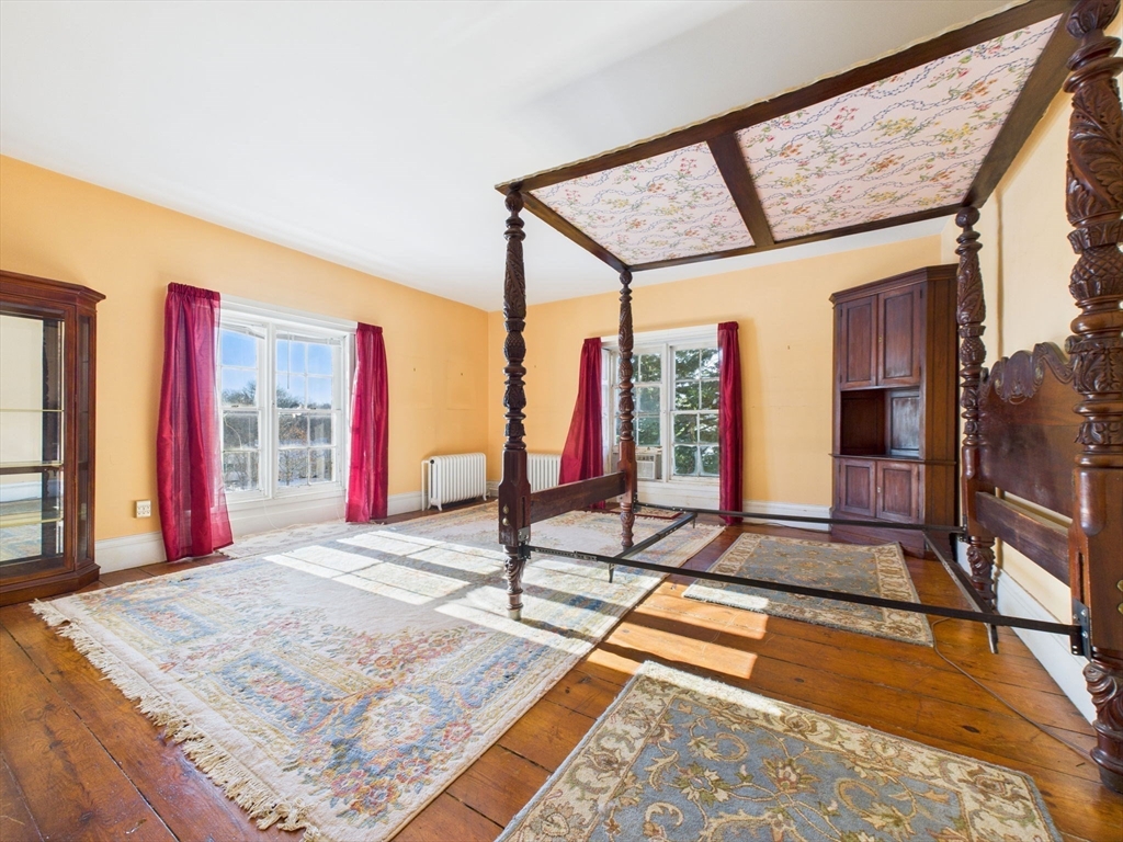 181 Washington Street Fairhaven, MA 02719 - Photo 20 of 41 a view of an empty room with wooden floor and windows