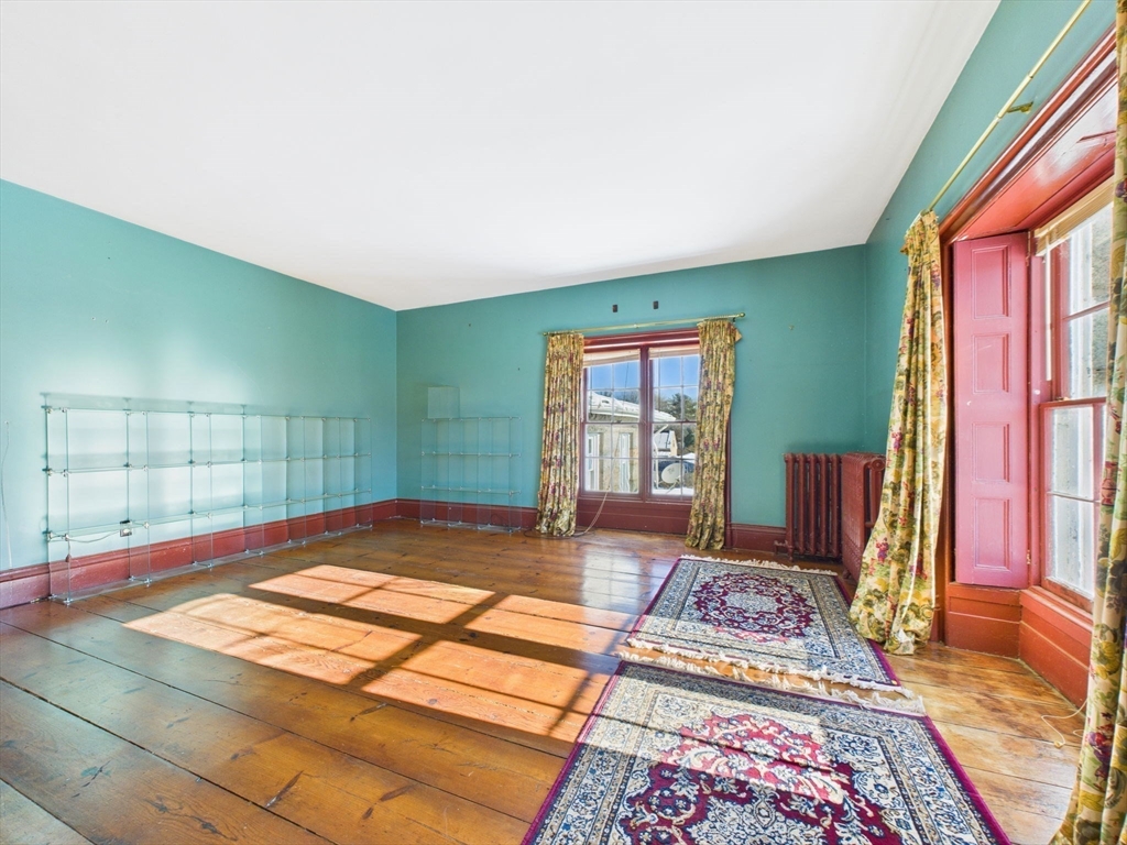 181 Washington Street Fairhaven, MA 02719 - Photo 22 of 41 a bedroom with a bed and window