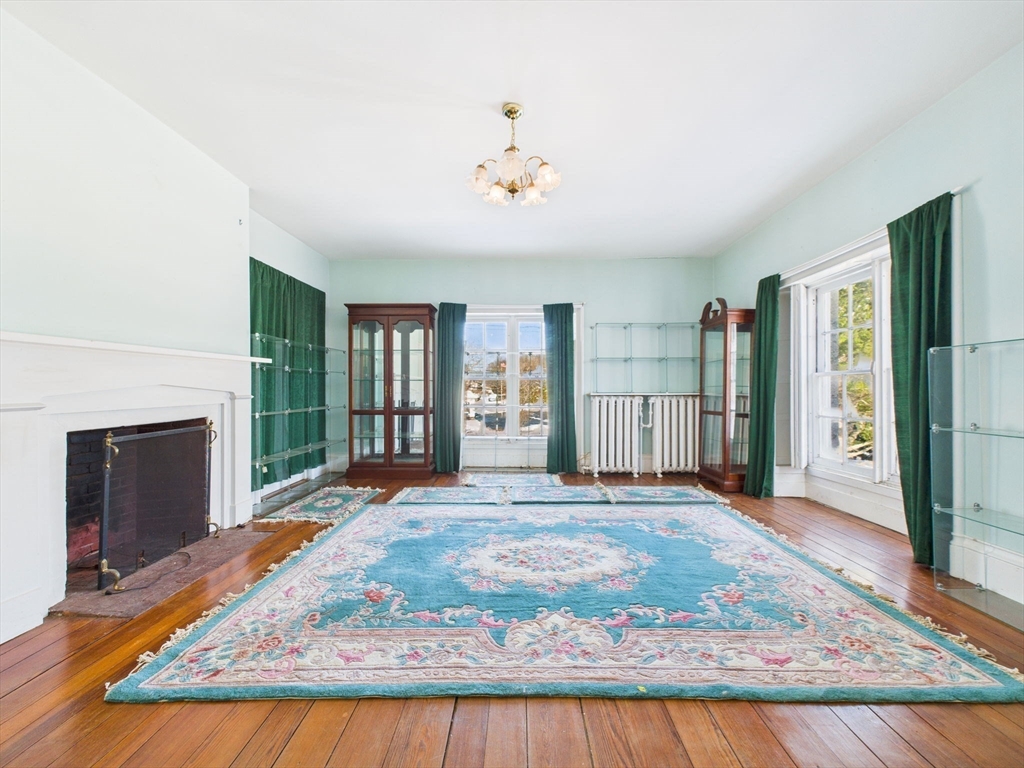 181 Washington Street Fairhaven, MA 02719 - Photo 26 of 41 a view of an empty room with closet and fireplace
