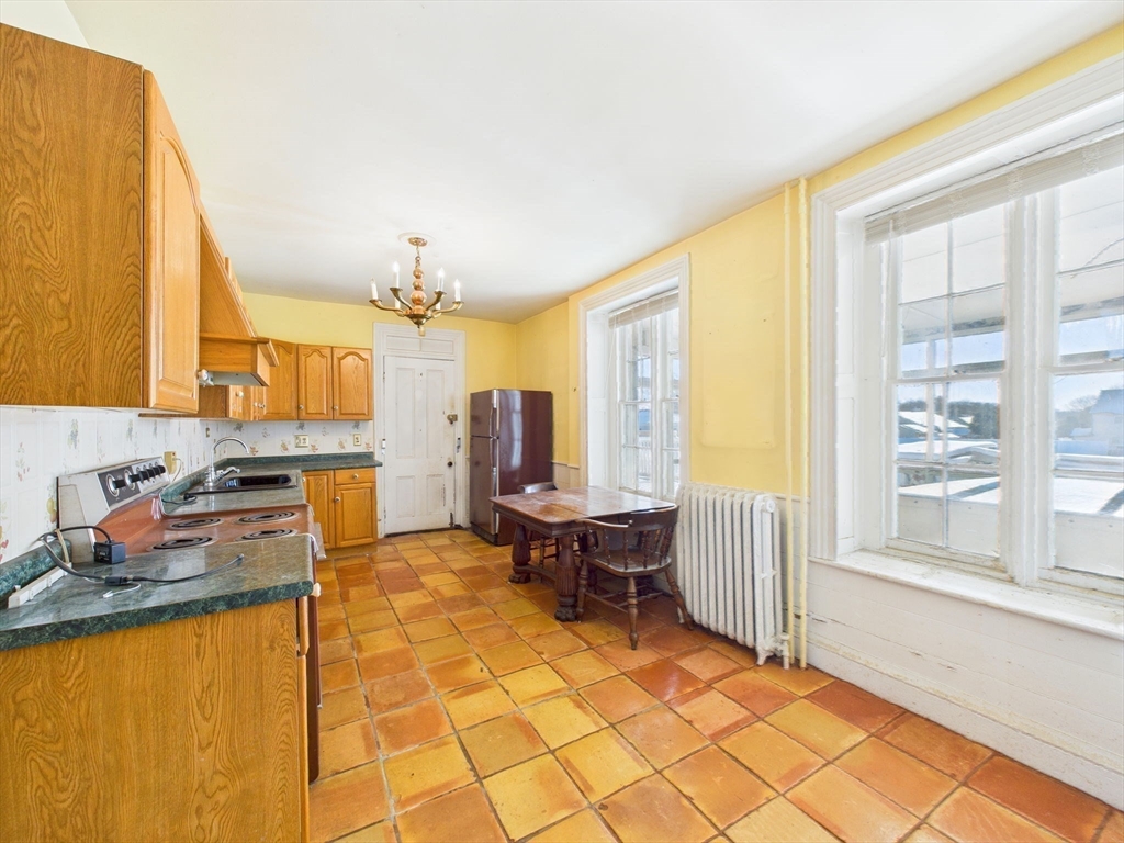 181 Washington Street Fairhaven, MA 02719 - Photo 35 of 41 a living room with fireplace furniture and a large window