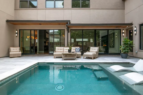 a house view with pool table and chairs
