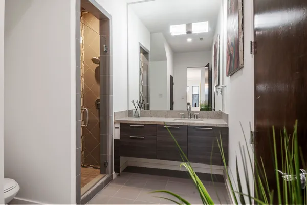 a bathroom with a double vanity sink and a mirror