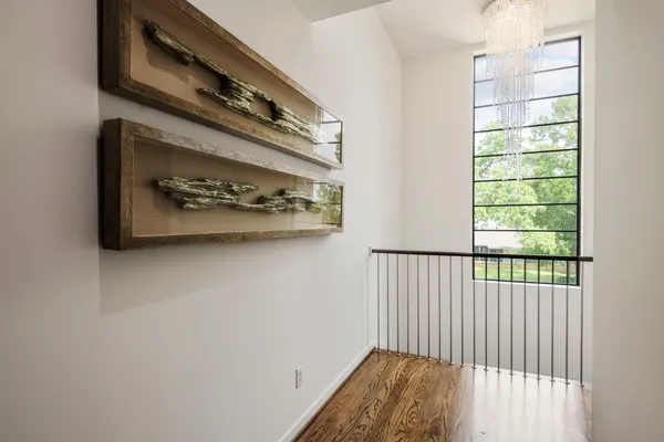 a view of a hallway with windows