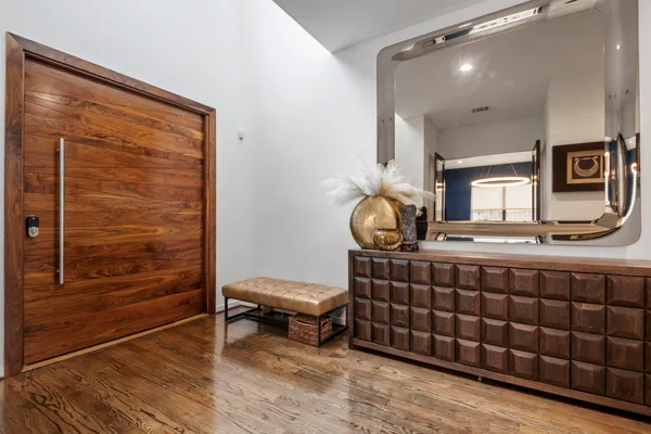 a room with a table chairs and a rug