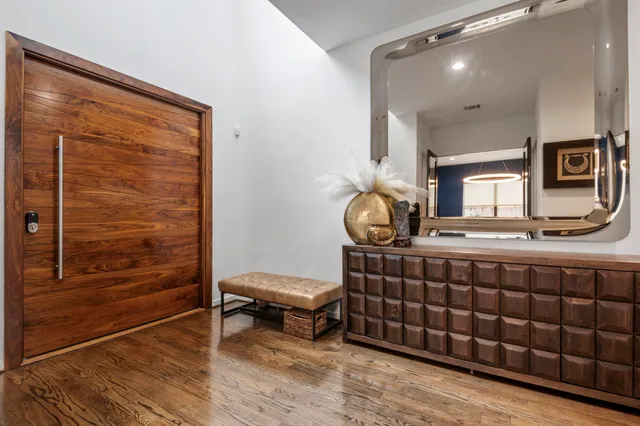 a room with a table chairs and a rug