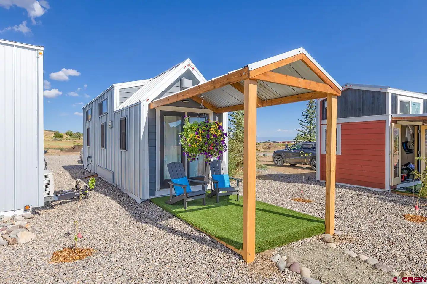 22130 6850 Road, Unit 210215 Montrose, CO 81403 - Photo 8 of 35 a view of a house with a backyard