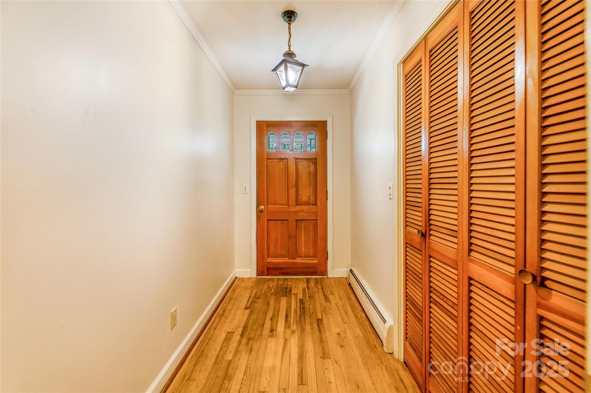 679 Solomon Jones Road Cedar Mountain, NC 28718 - Photo 14 of 47 a view of a room with wooden floor and windows