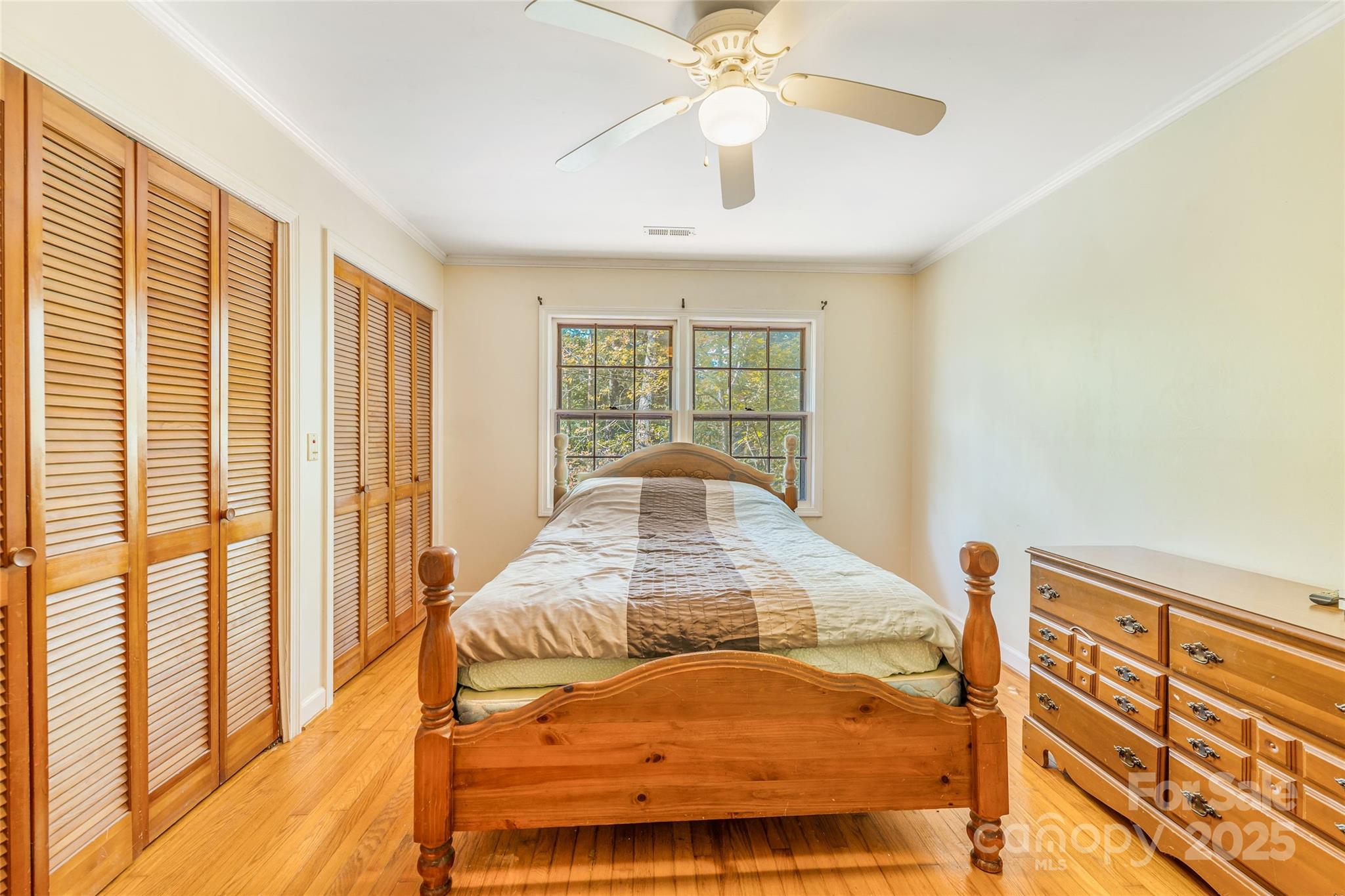 679 Solomon Jones Road Cedar Mountain, NC 28718 - Photo 28 of 47 a bed sitting in a spacious bedroom next to a window