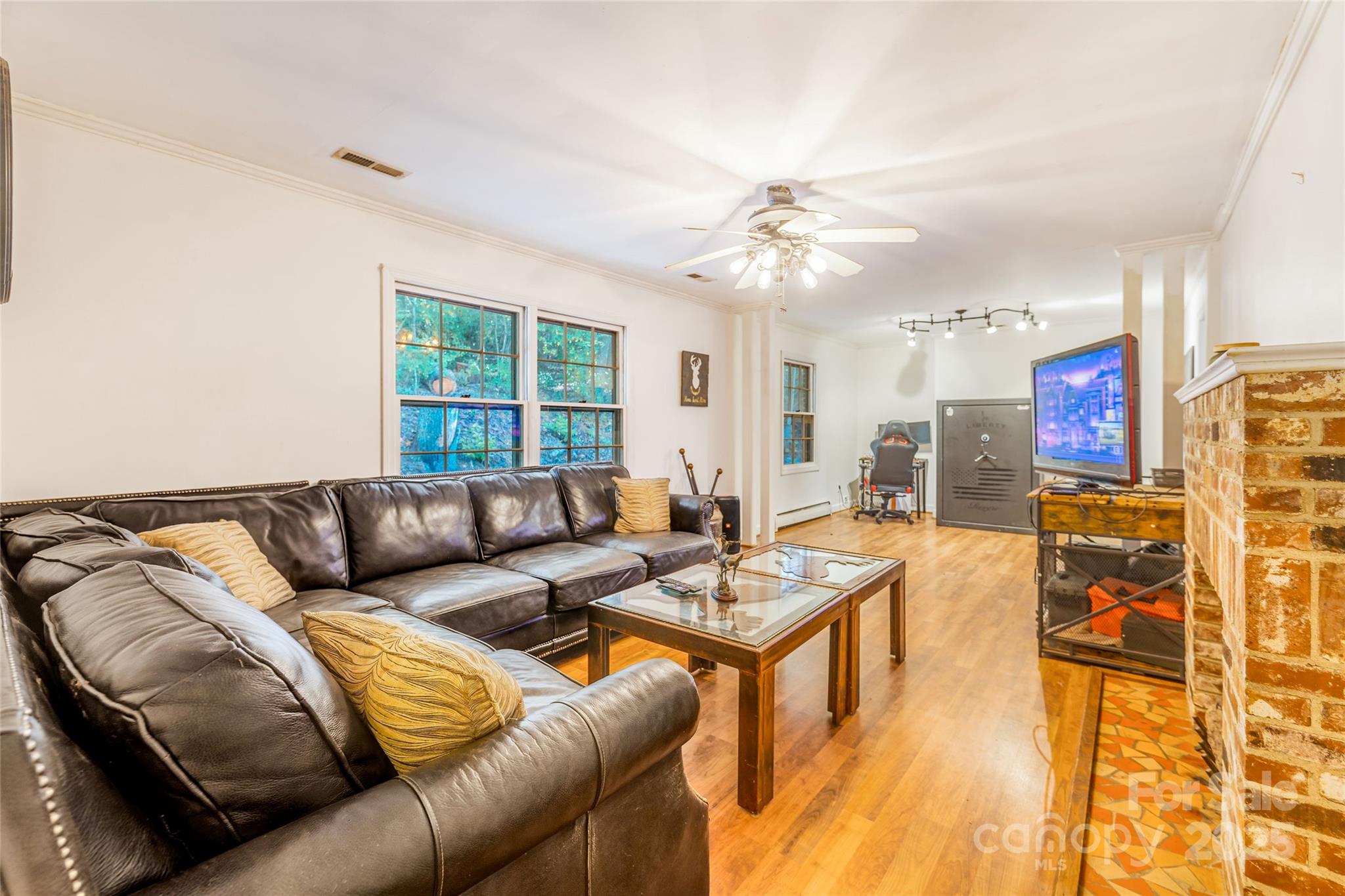 679 Solomon Jones Road Cedar Mountain, NC 28718 - Photo 29 of 47 a living room with furniture and a large window
