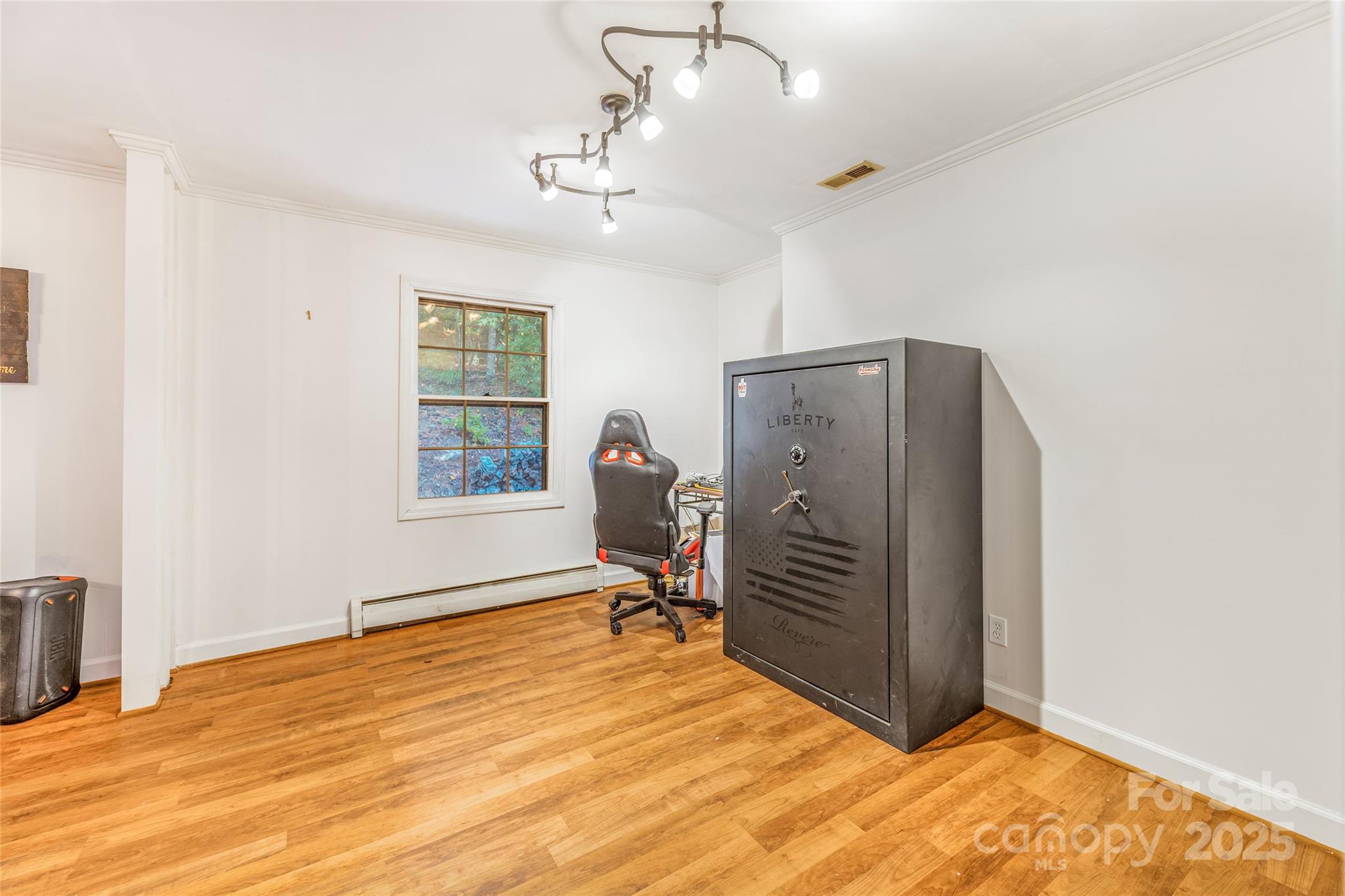 679 Solomon Jones Road Cedar Mountain, NC 28718 - Photo 32 of 47 a view of an empty room with wooden floor and a window