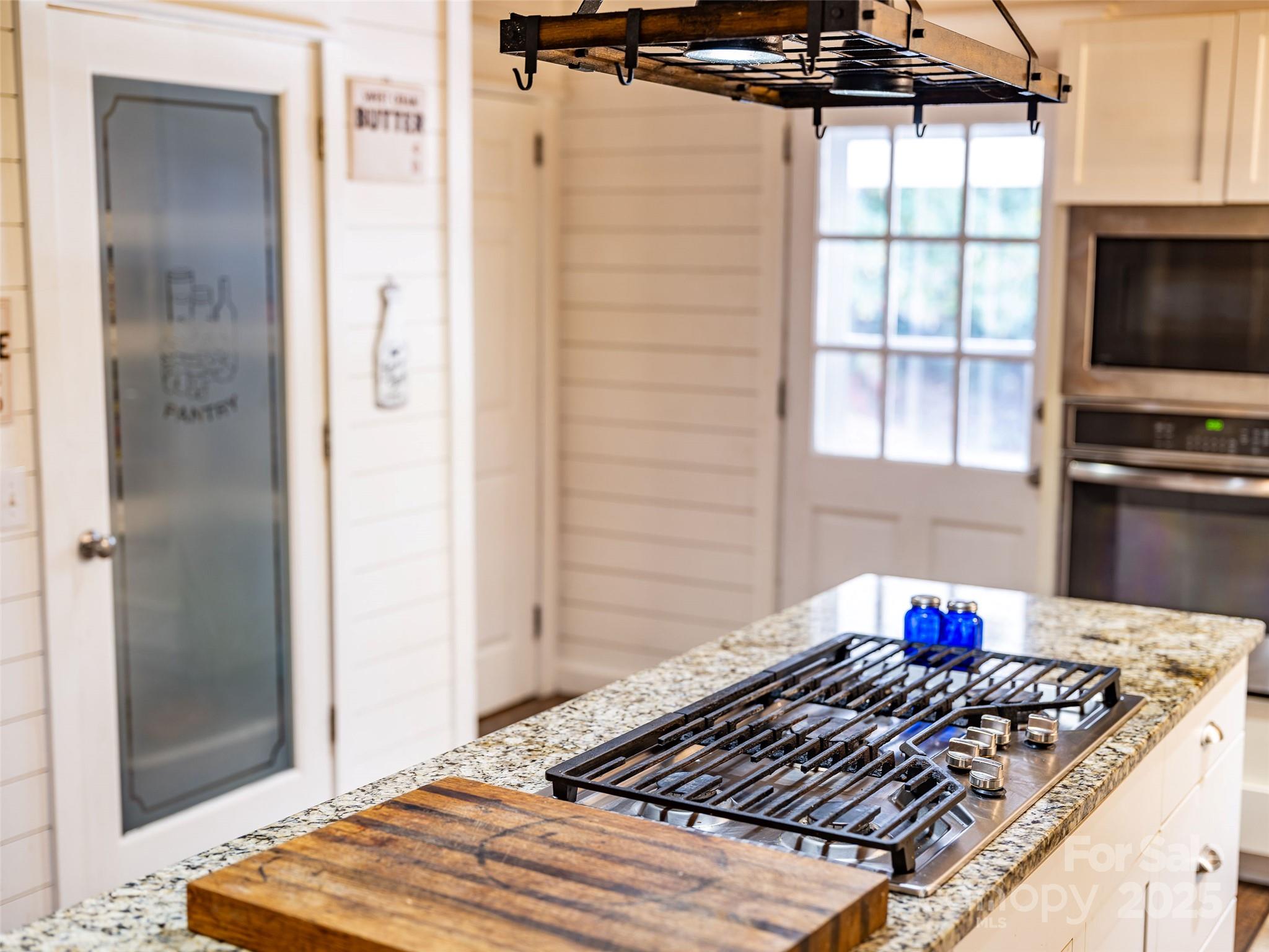 679 Solomon Jones Road Cedar Mountain, NC 28718 - Photo 35 of 47 a bedroom with a bed and a flat screen tv