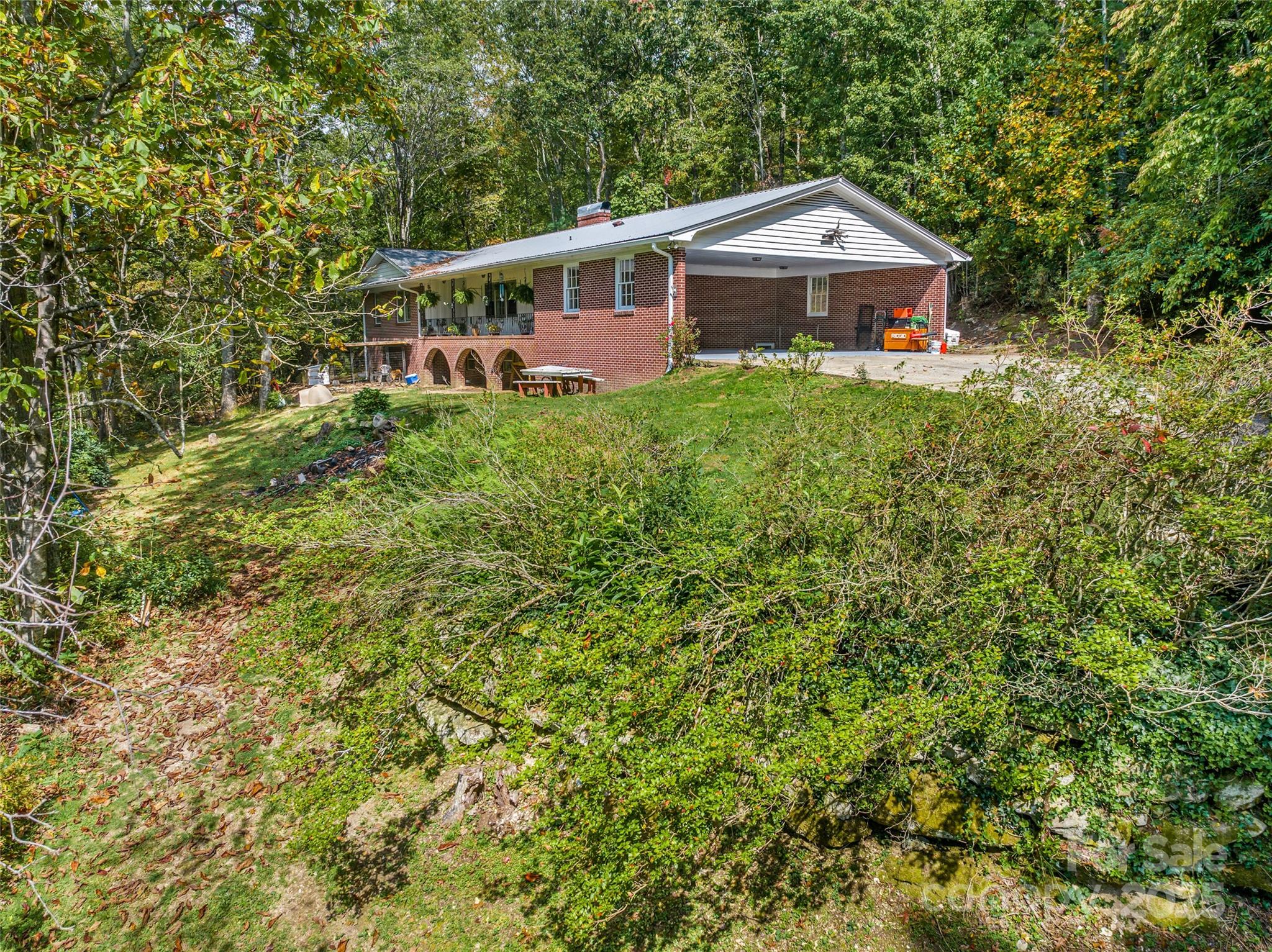 679 Solomon Jones Road Cedar Mountain, NC 28718 - Photo 5 of 47 a front view of a house with a yard and trees
