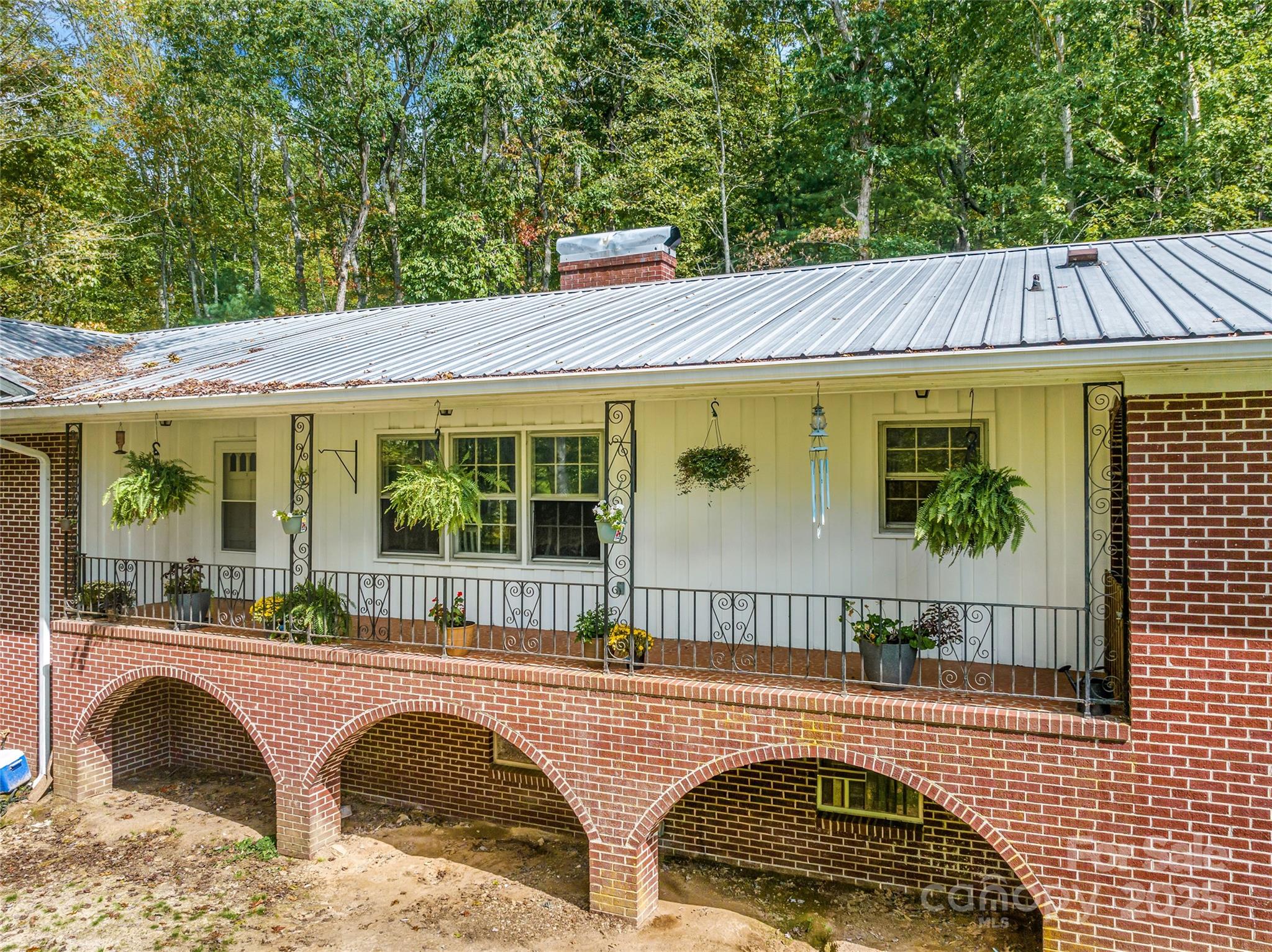 679 Solomon Jones Road Cedar Mountain, NC 28718 - Photo 6 of 47 a front view of a house with garden
