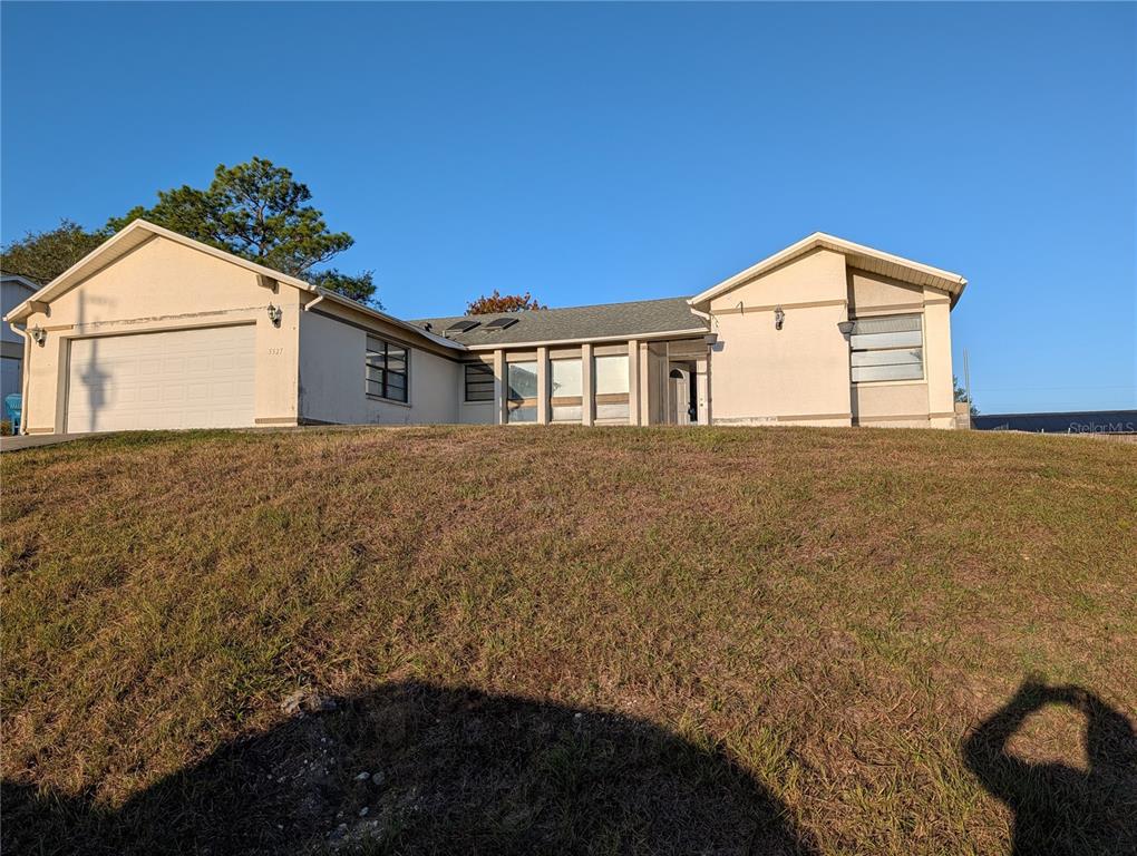 5327 Baldock Avenue Spring Hill, FL 34608 - Photo 1 of 14 a big house with a big yard and more windows