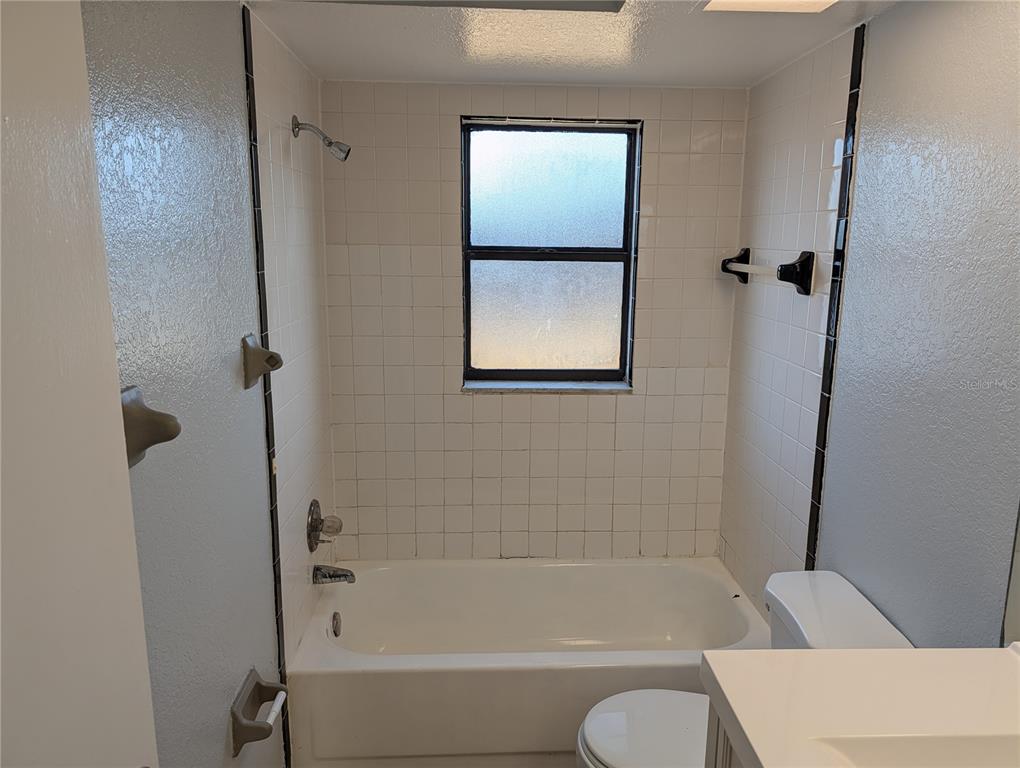 5327 Baldock Avenue Spring Hill, FL 34608 - Photo 7 of 14 a bathroom with a tub and shower