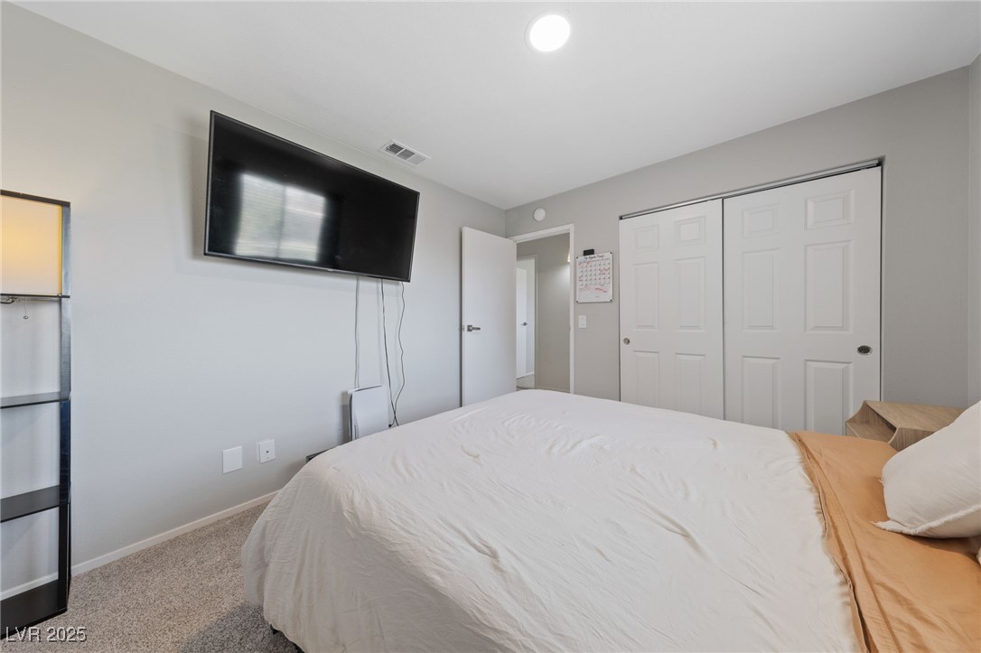 2637 Rialto Road Las Vegas, NV 89108 - Photo 18 of 22 Bedroom with a closet, visible vents, baseboards, and carpet flooring