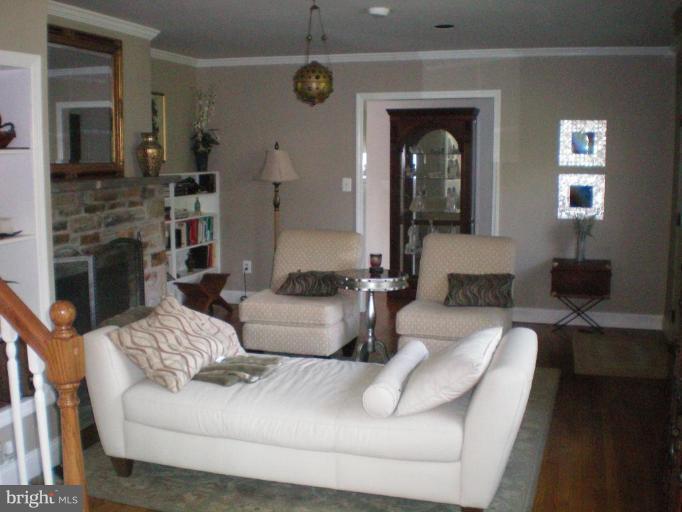 4030 Crescent Road Ellicott City, MD 21042 - Photo 14 of 29 a living room with furniture and a fireplace