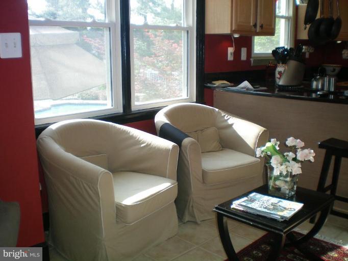 4030 Crescent Road Ellicott City, MD 21042 - Photo 15 of 29 a living room with furniture and a potted plant