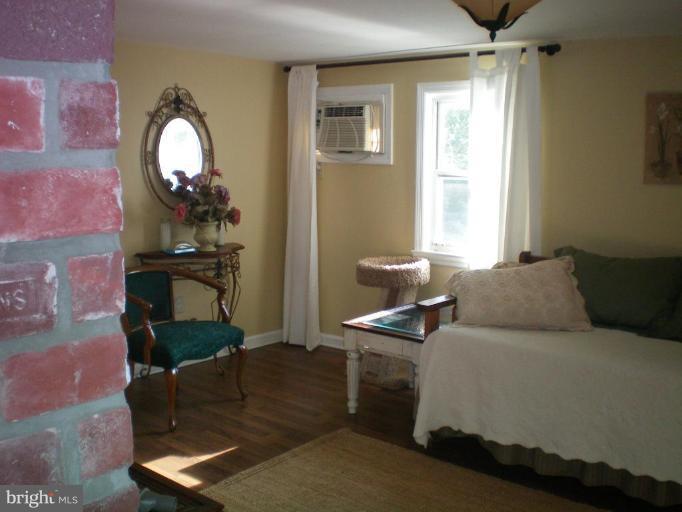 4030 Crescent Road Ellicott City, MD 21042 - Photo 23 of 29 a living room with furniture and a mirror