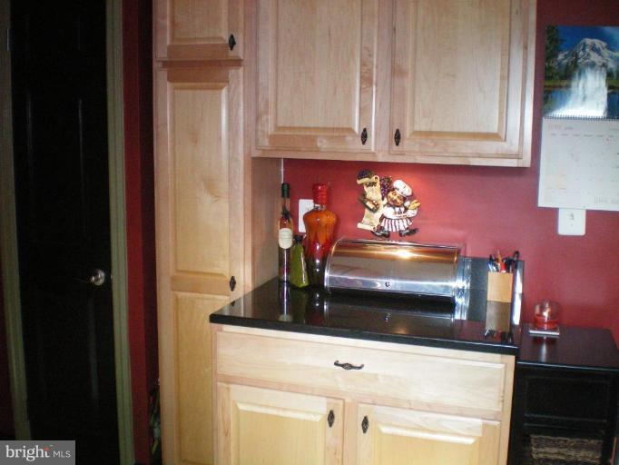 4030 Crescent Road Ellicott City, MD 21042 - Photo 6 of 29 a kitchen with a sink and cabinets