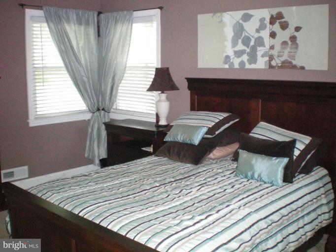 4030 Crescent Road Ellicott City, MD 21042 - Photo 10 of 29 a bedroom with a bed and window