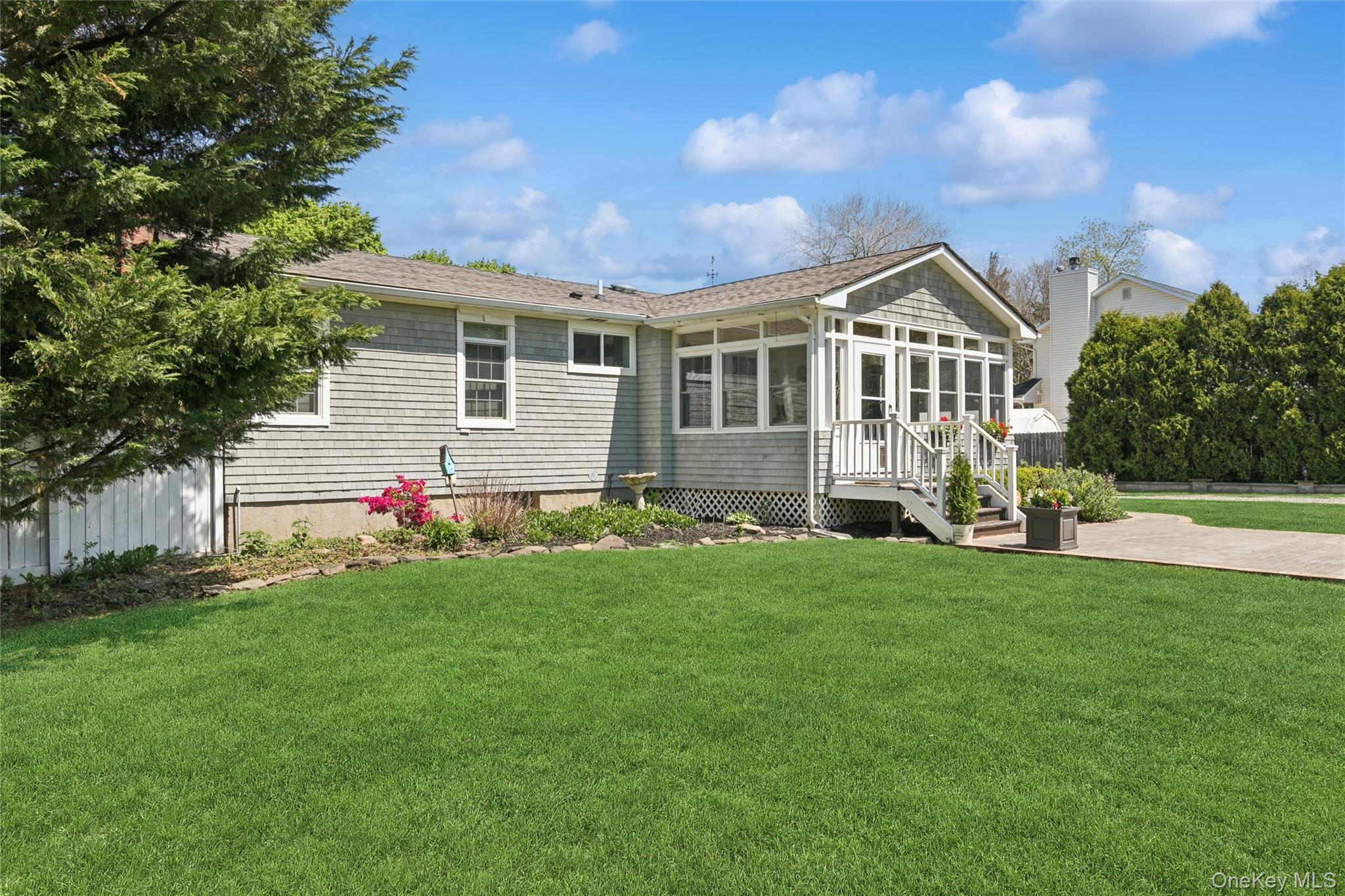 1039 Middle Road Riverhead, NY 11901 - Photo 12 of 34 a front view of house with yard and green space