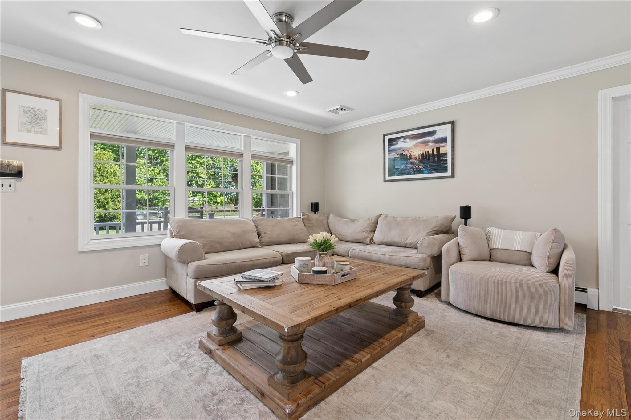 1039 Middle Road Riverhead, NY 11901 - Photo 15 of 34 a living room with furniture and a large window