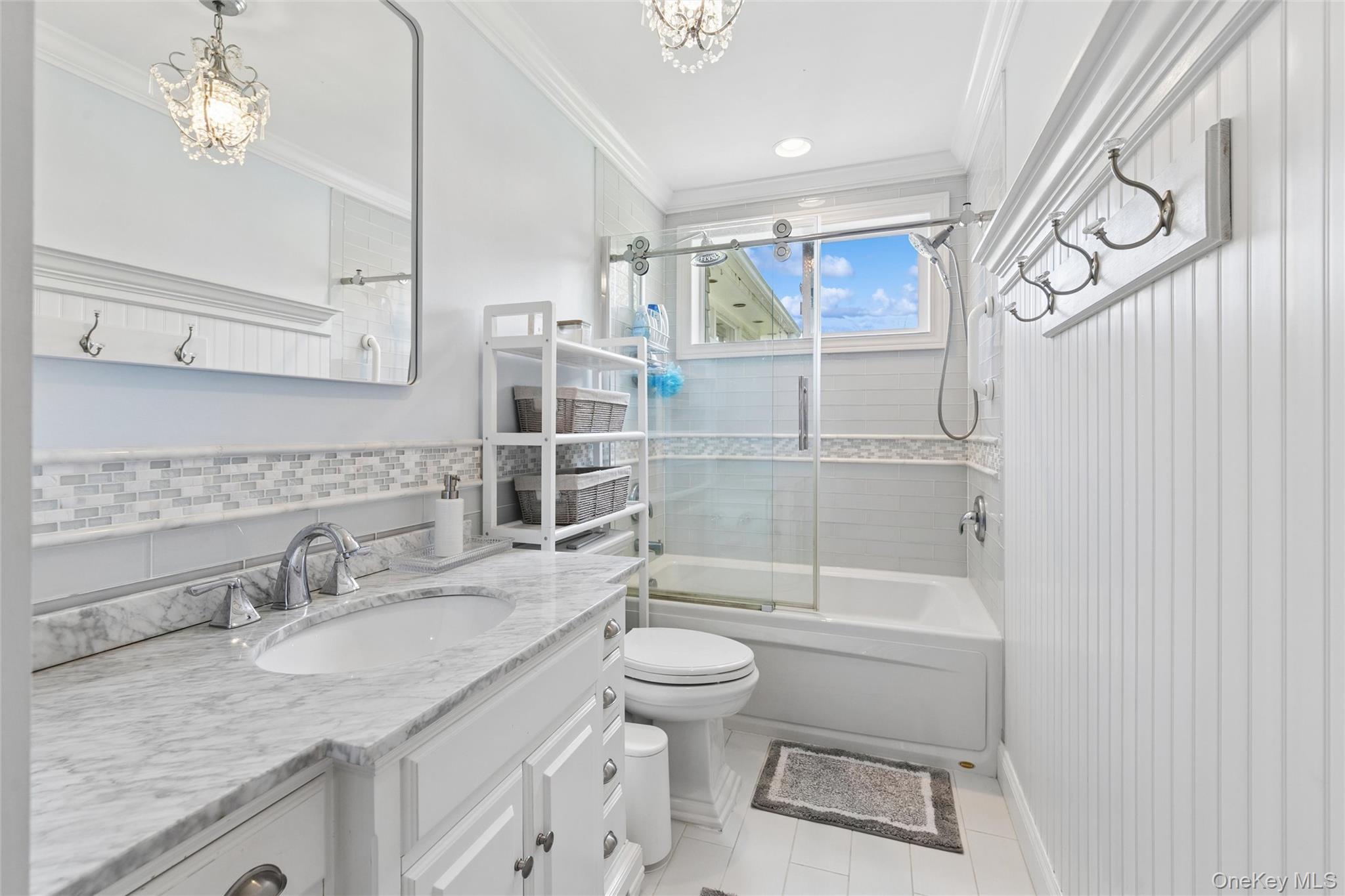 1039 Middle Road Riverhead, NY 11901 - Photo 19 of 34 a bathroom with a granite countertop sink a toilet and shower