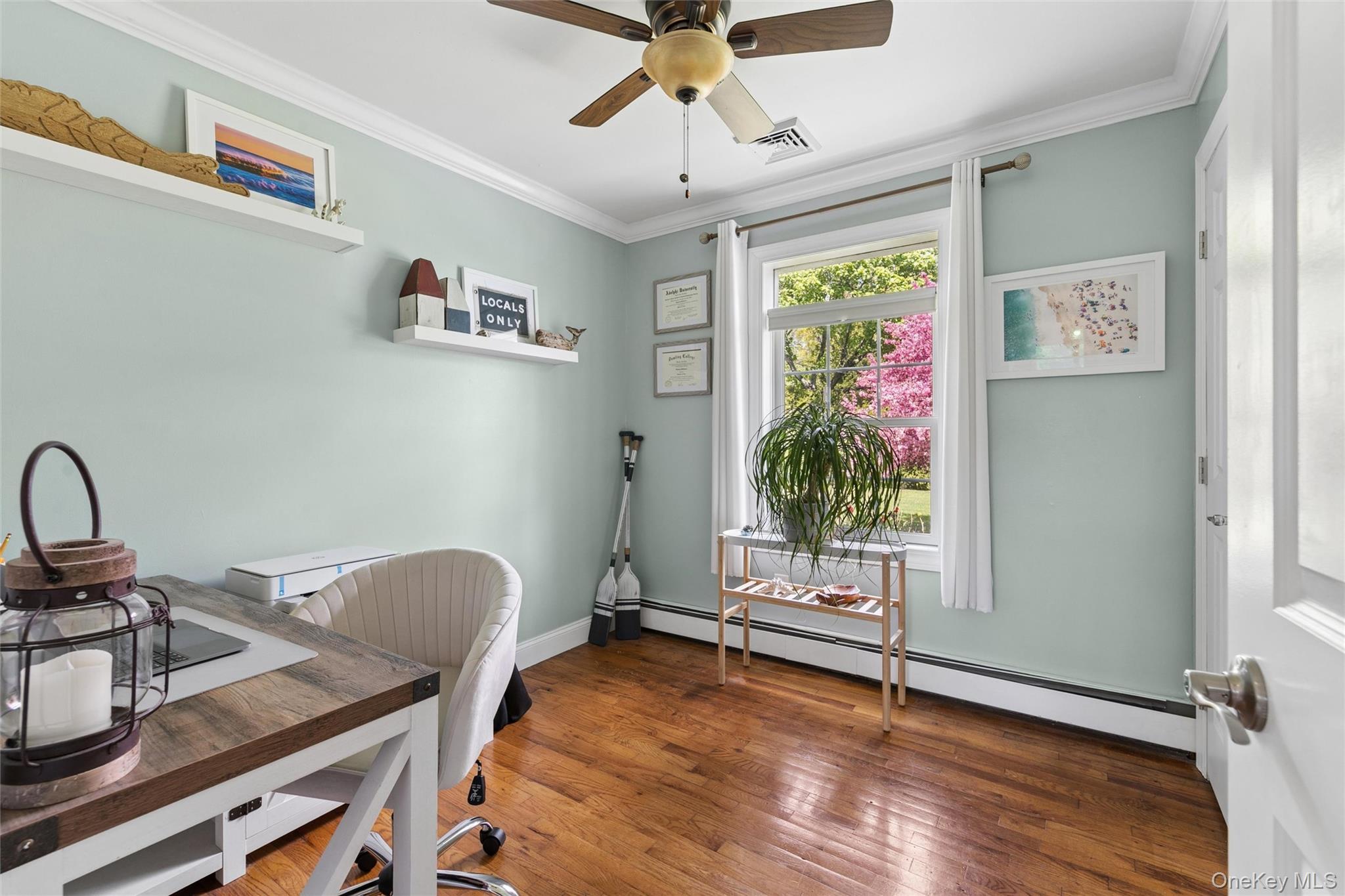 1039 Middle Road Riverhead, NY 11901 - Photo 20 of 34 a workspace with furniture window and wooden floor