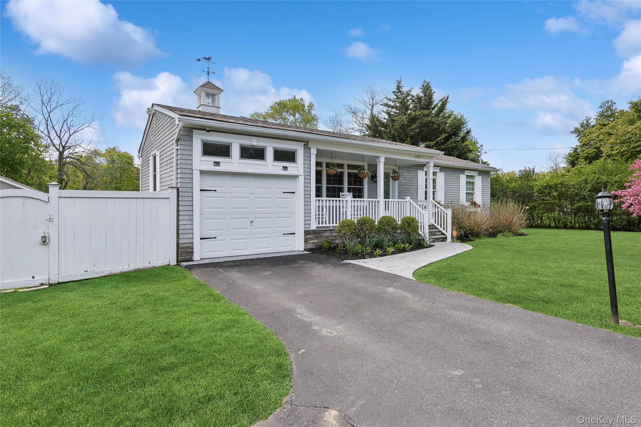 1039 Middle Road Riverhead, NY 11901 - Photo 2 of 34 a front view of house with yard and green space