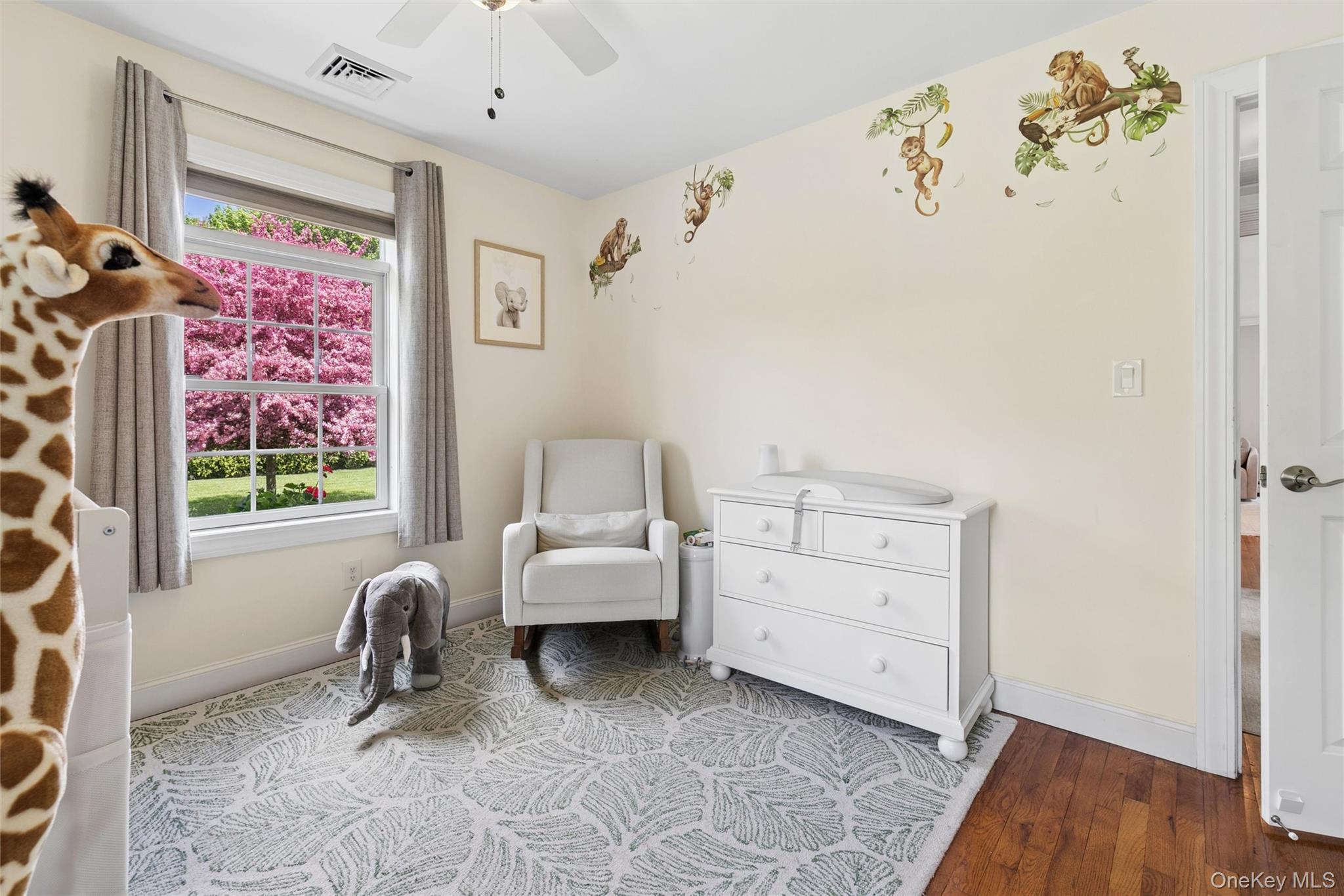 1039 Middle Road Riverhead, NY 11901 - Photo 23 of 34 a room with furniture and a window