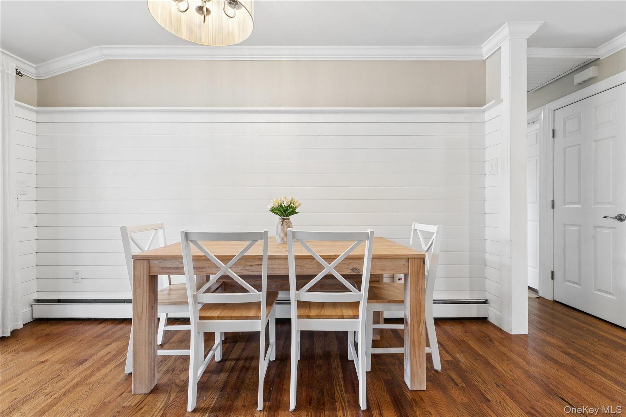 1039 Middle Road Riverhead, NY 11901 - Photo 29 of 34 a dining room with furniture and wooden floor