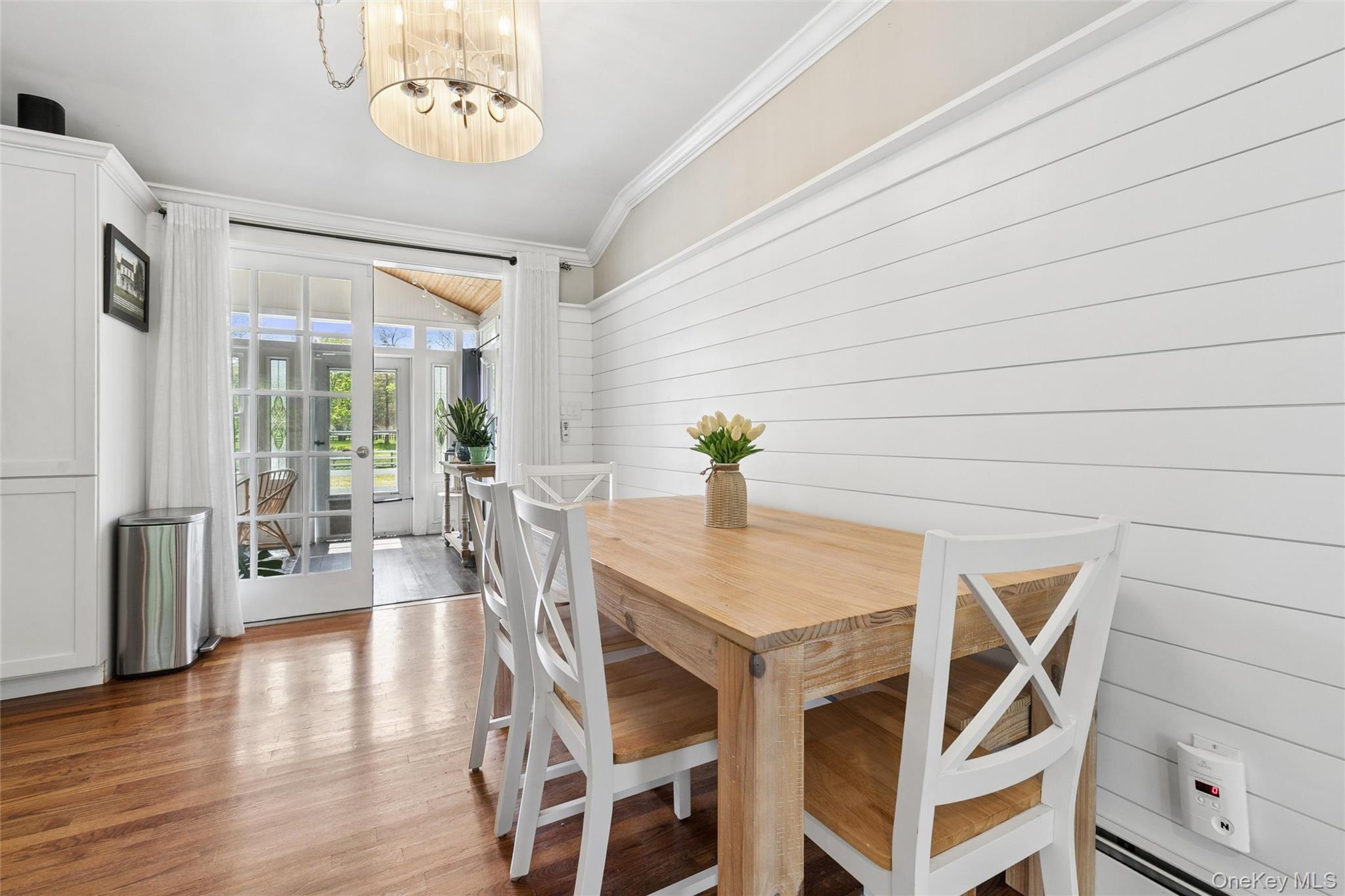 1039 Middle Road Riverhead, NY 11901 - Photo 30 of 34 a view of a dining room with furniture and wooden floor