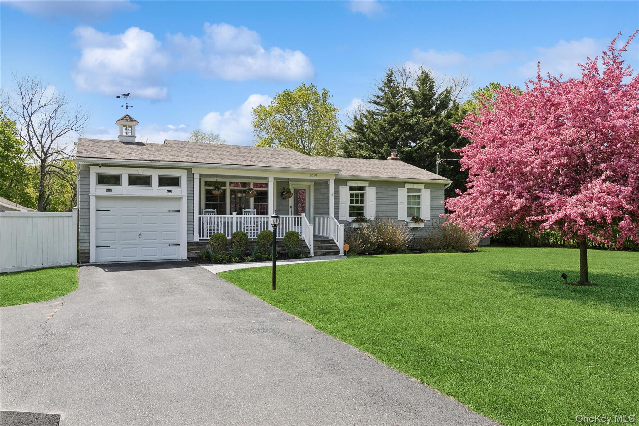 1039 Middle Road Riverhead, NY 11901 - Photo 3 of 34 front view of a house with a yard