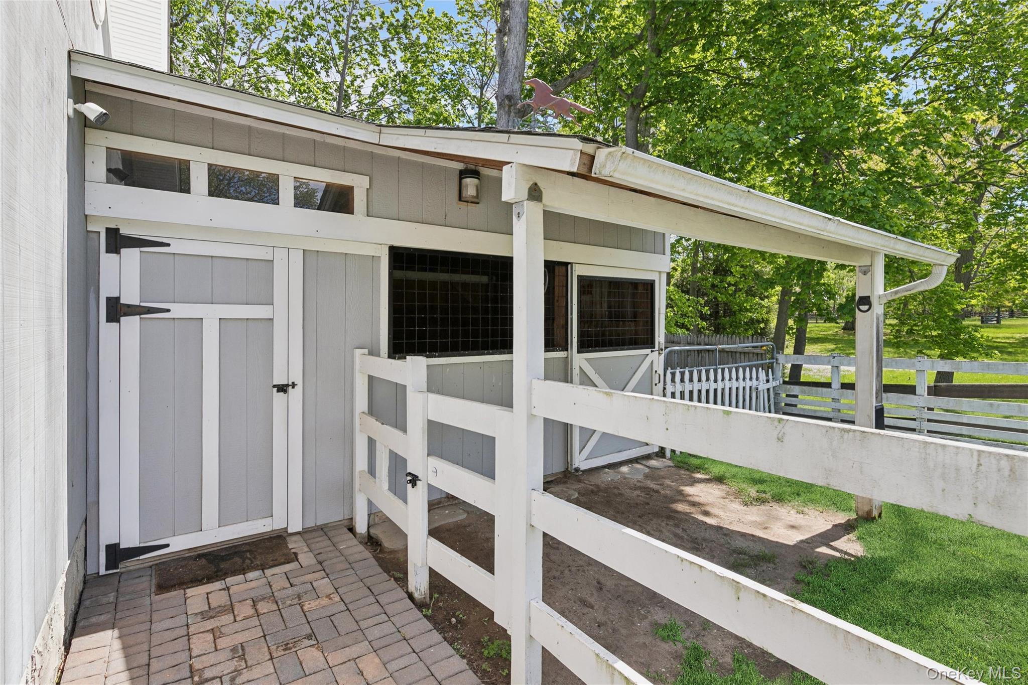 1039 Middle Road Riverhead, NY 11901 - Photo 33 of 34 a view of a house with backyard and porch