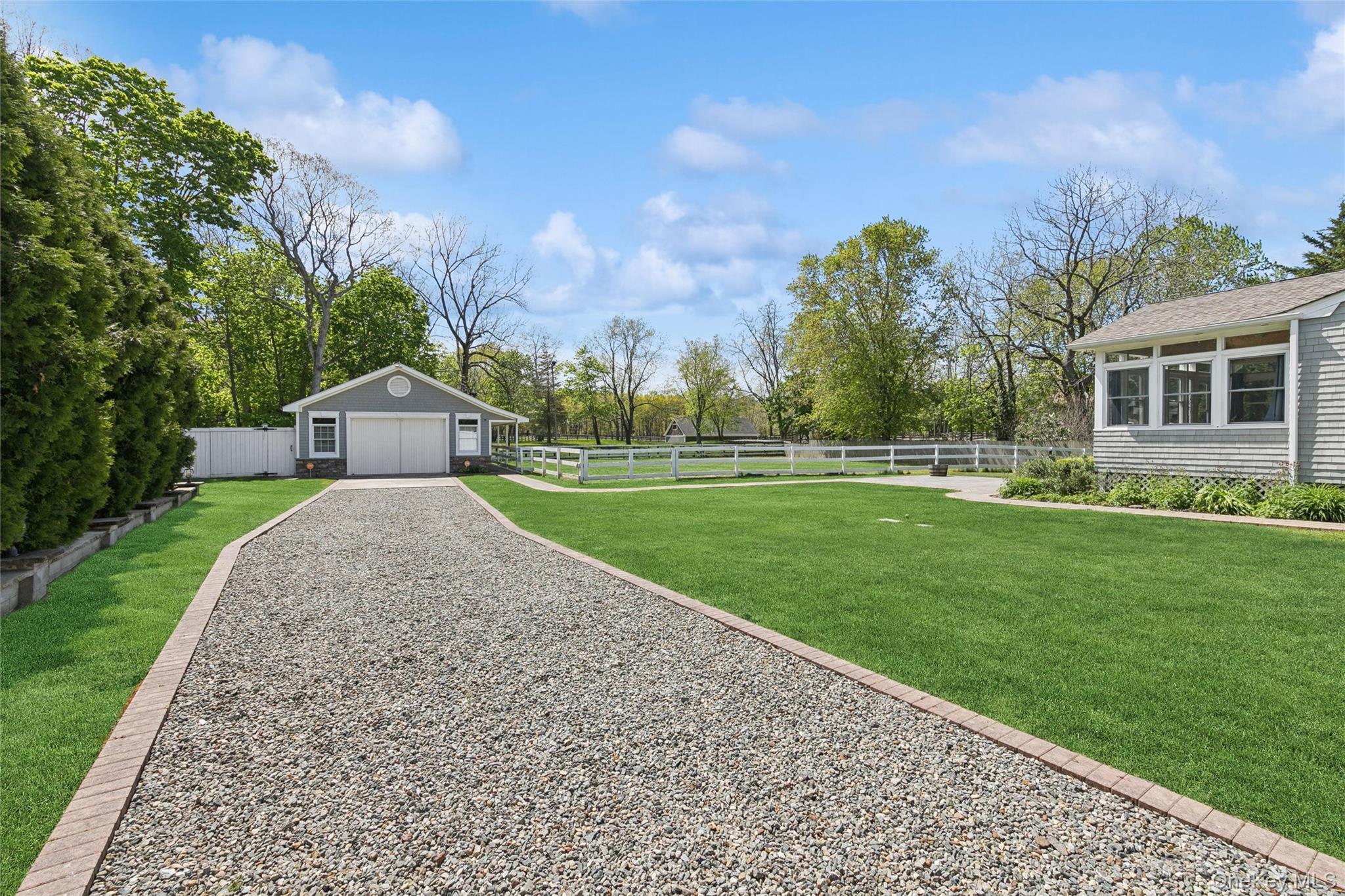 1039 Middle Road Riverhead, NY 11901 - Photo 6 of 34 a front view of house with yard and green space