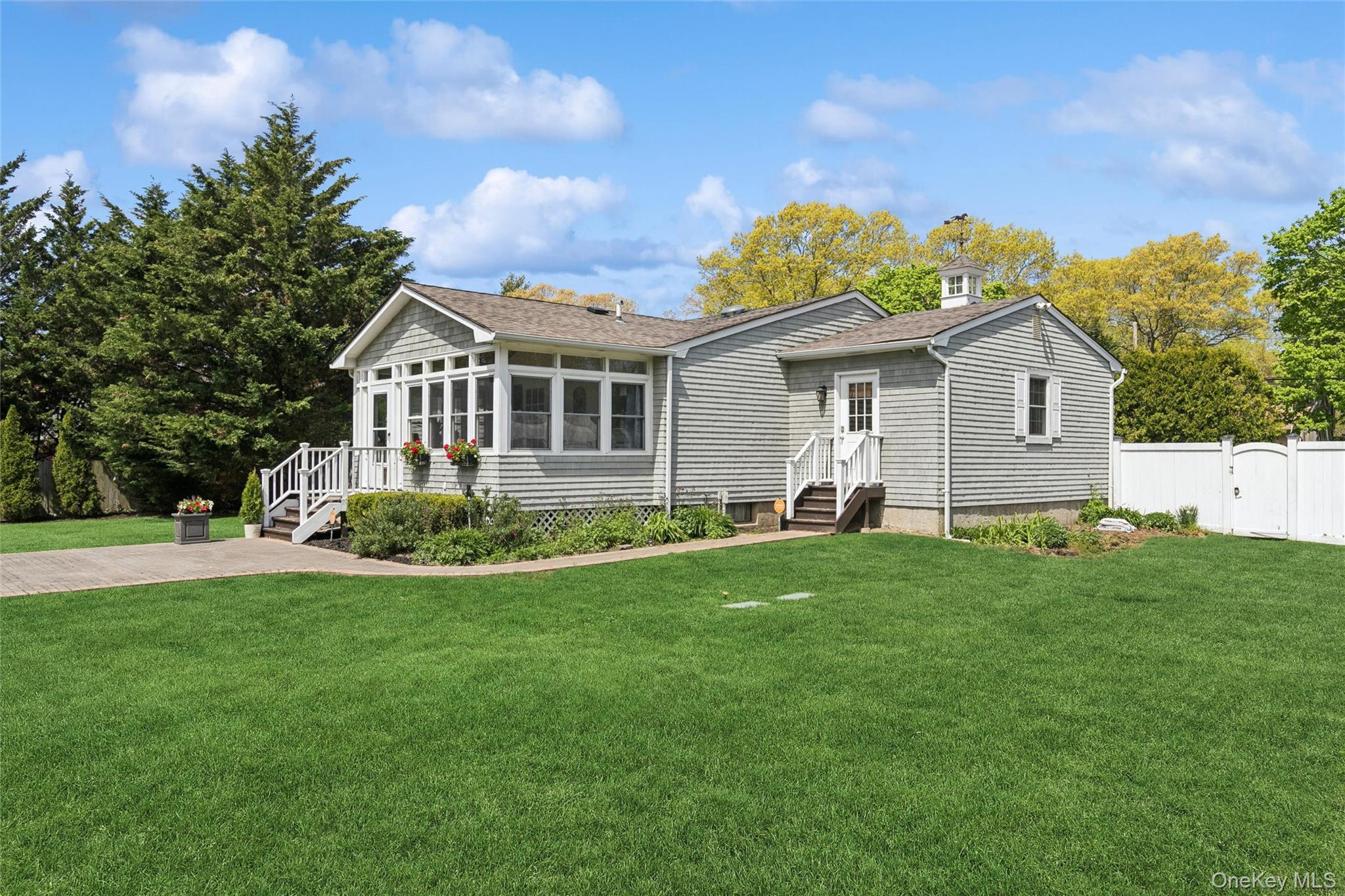 1039 Middle Road Riverhead, NY 11901 - Photo 8 of 34 a view of a house with a yard and potted plants
