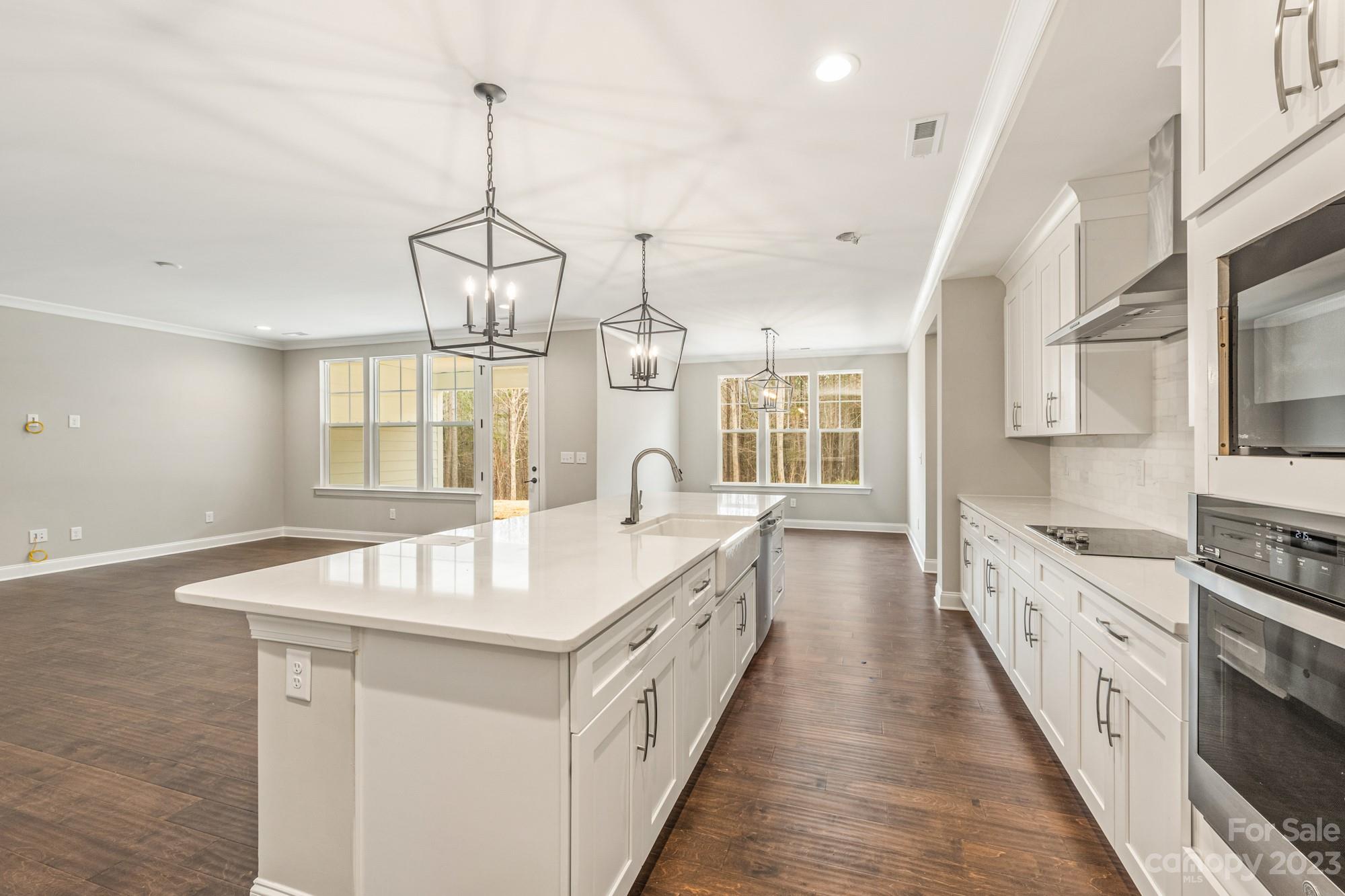 4024 Red Hl Way Denver, NC 28037 - Photo 14 of 22 a kitchen with granite countertop a sink stove and refrigerator