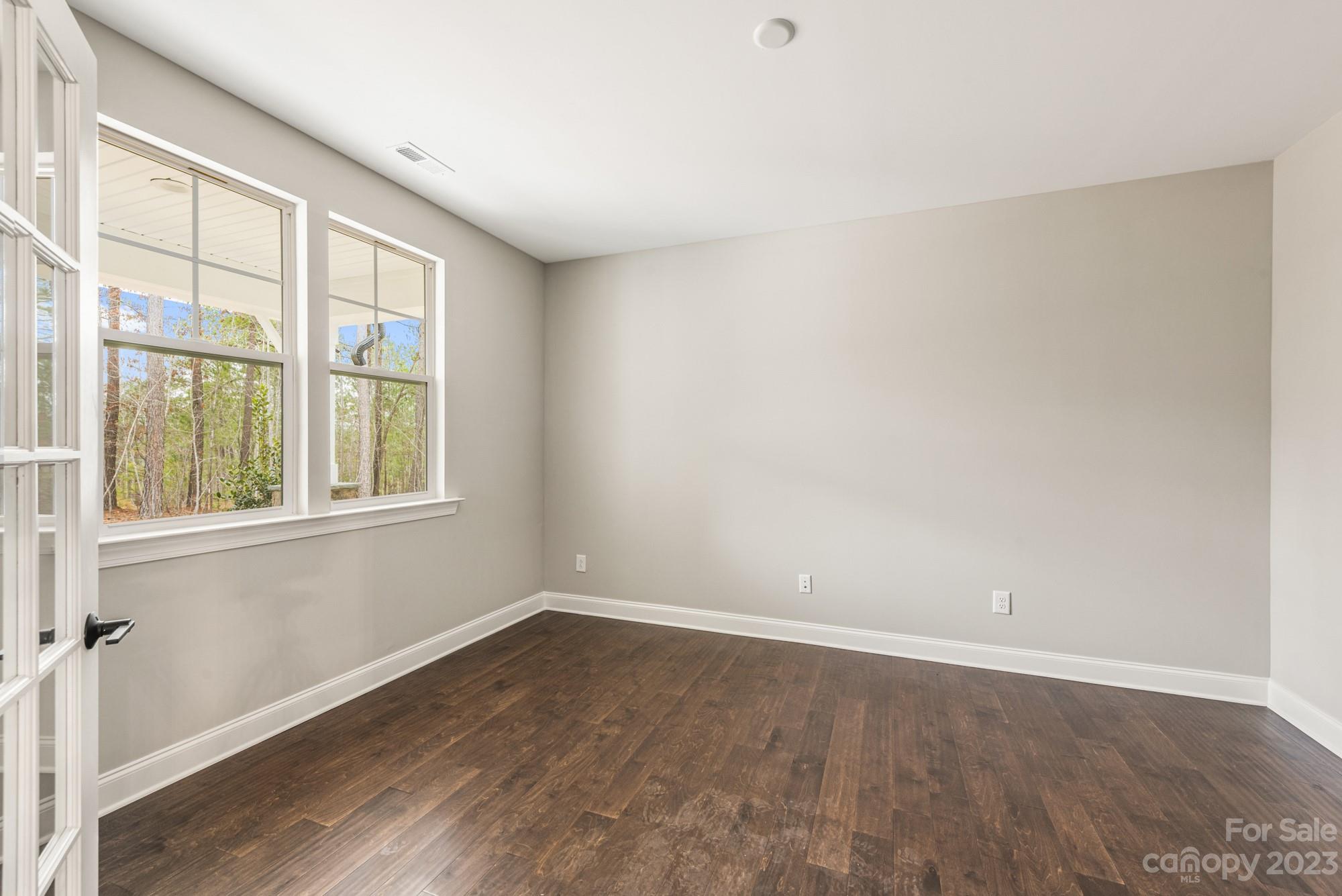 4024 Red Hl Way Denver, NC 28037 - Photo 21 of 22 wooden floor in an empty room with a window